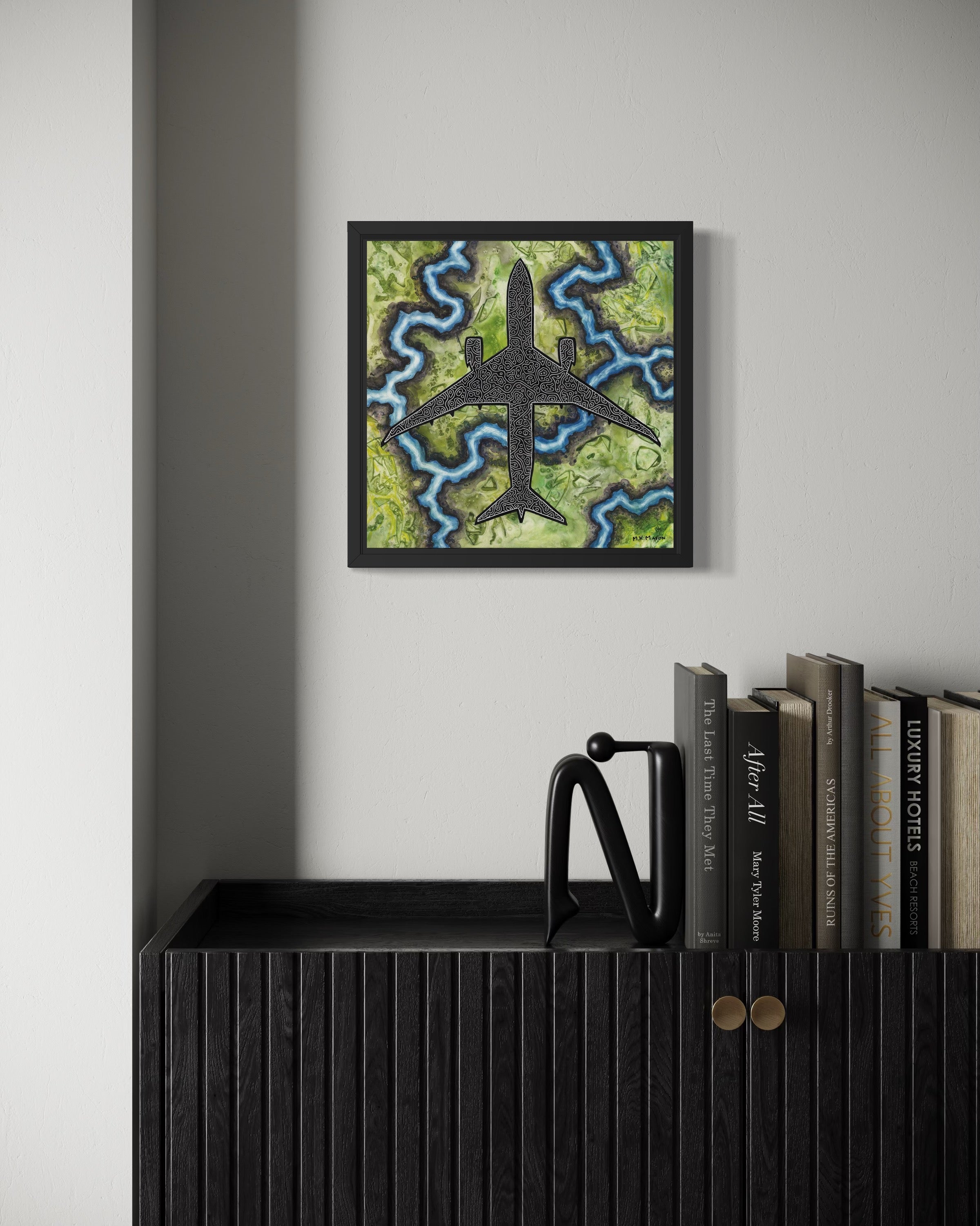 Top-down painting of a Boeing 787 with black-and-white abstract patterns over textured green and blue terrain, artwork by MK Mason, interior mockup