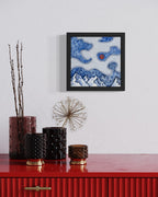 Abstract mountain landscape beneath swirling white linework clouds with a red blood moon, watercolor and ink artwork by MK Mason, interior mockup