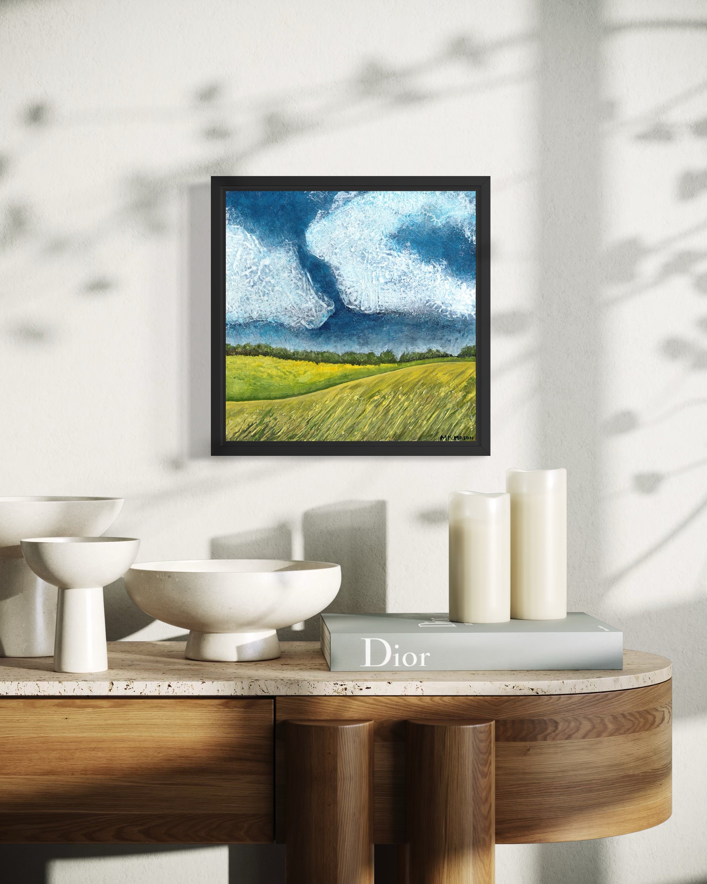 Acrylic landscape painting inspired by Stonehenge, with golden grass fields, dark blue textured sky, and soft white clouds, artwork by MK Mason, interior mockup