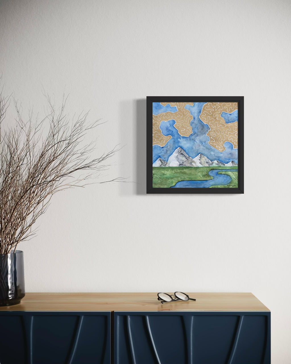 Watercolor landscape featuring a winding river, snowy mountain peaks, green fields, and tan abstract cloud-like patterns, artwork by MK Mason, interior mockup